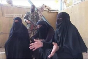İŞİD komandiri qadın paltarında yaxalandı - VİDEO